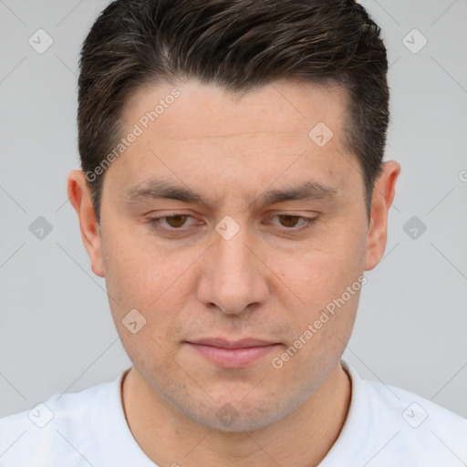 Joyful white adult male with short  brown hair and brown eyes