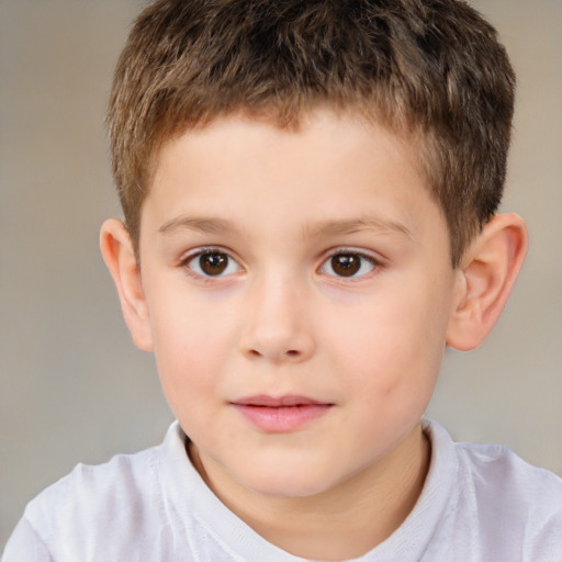 Joyful white child male with short  brown hair and brown eyes