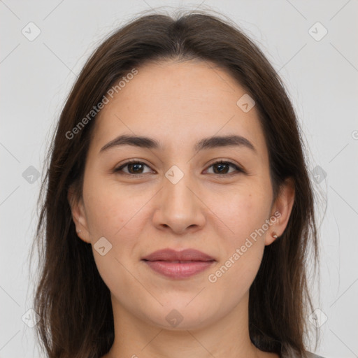 Joyful white young-adult female with long  brown hair and brown eyes