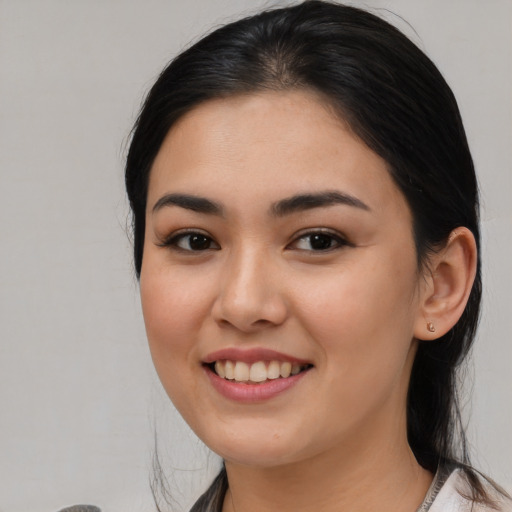 Joyful asian young-adult female with medium  brown hair and brown eyes