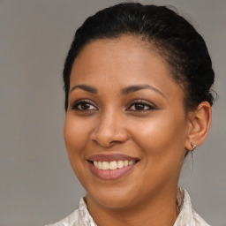 Joyful latino young-adult female with short  brown hair and brown eyes