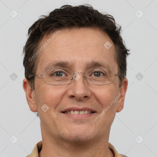 Joyful white adult male with short  brown hair and brown eyes