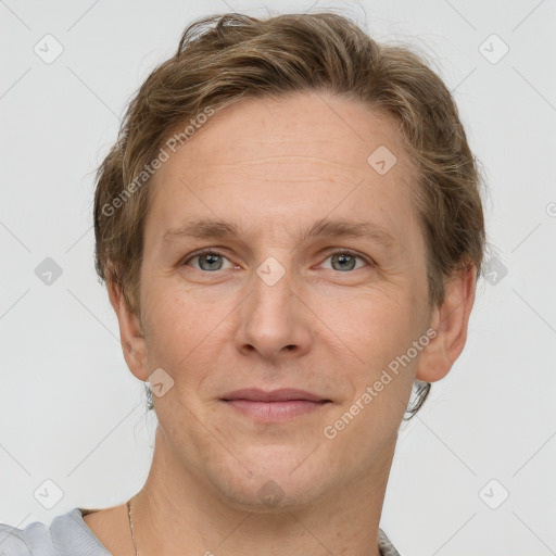 Joyful white adult male with short  brown hair and grey eyes