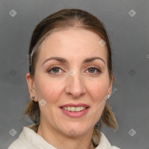 Joyful white adult female with medium  brown hair and blue eyes