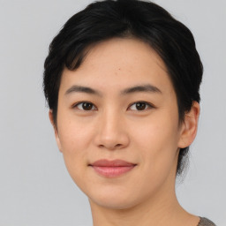 Joyful asian young-adult female with short  black hair and brown eyes