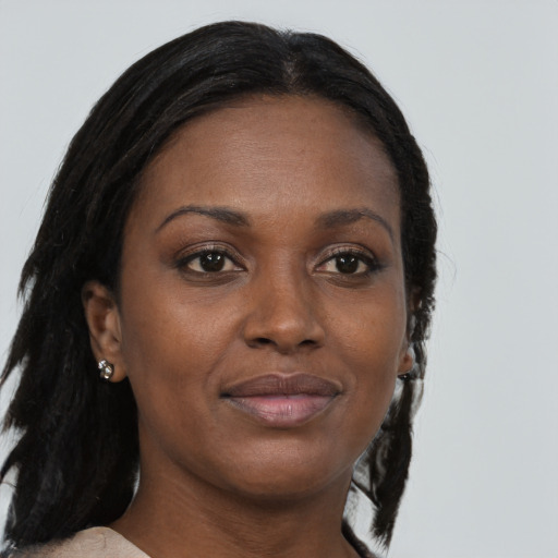 Joyful black young-adult female with medium  brown hair and brown eyes