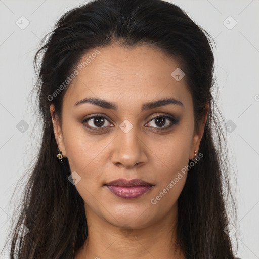 Joyful latino young-adult female with long  brown hair and brown eyes