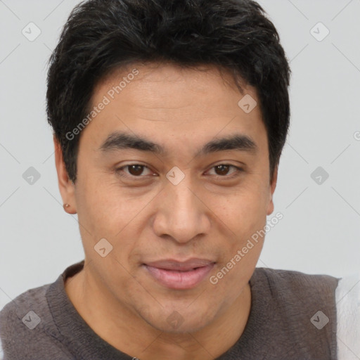 Joyful latino young-adult male with short  brown hair and brown eyes