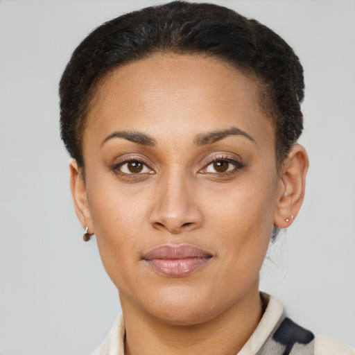 Joyful latino young-adult female with short  brown hair and brown eyes