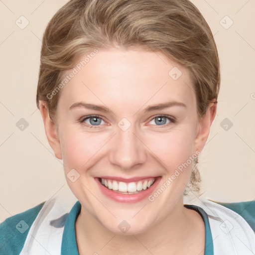 Joyful white young-adult female with medium  brown hair and blue eyes