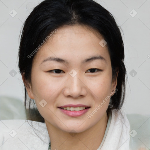 Joyful asian young-adult female with medium  black hair and brown eyes