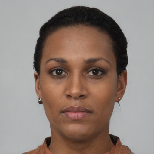 Neutral black young-adult female with short  black hair and brown eyes