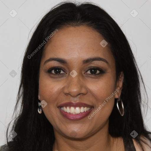 Joyful black young-adult female with long  brown hair and brown eyes