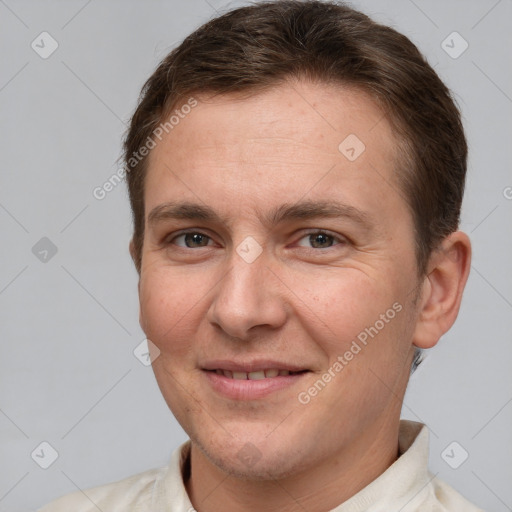 Joyful white adult male with short  brown hair and brown eyes