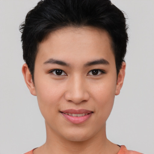 Joyful asian young-adult female with short  brown hair and brown eyes