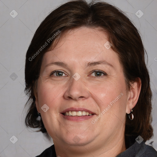 Joyful white adult female with medium  brown hair and brown eyes