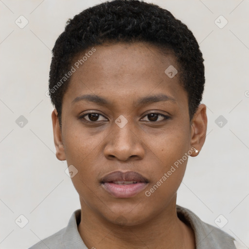 Joyful black young-adult female with short  black hair and brown eyes