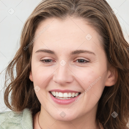 Joyful white young-adult female with medium  brown hair and green eyes