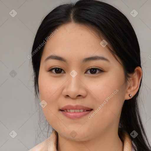 Joyful asian young-adult female with long  brown hair and brown eyes