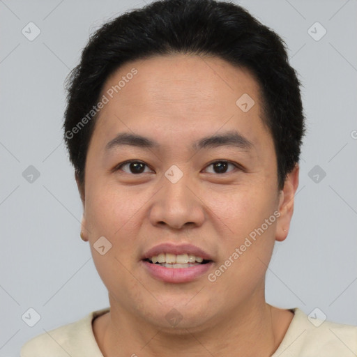 Joyful asian young-adult male with short  brown hair and brown eyes