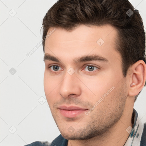 Neutral white young-adult male with short  brown hair and brown eyes