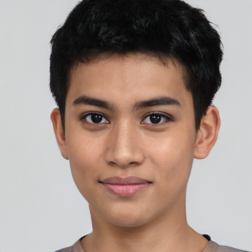 Joyful latino young-adult male with short  black hair and brown eyes