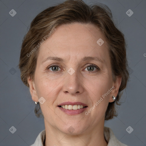 Joyful white adult female with medium  brown hair and grey eyes