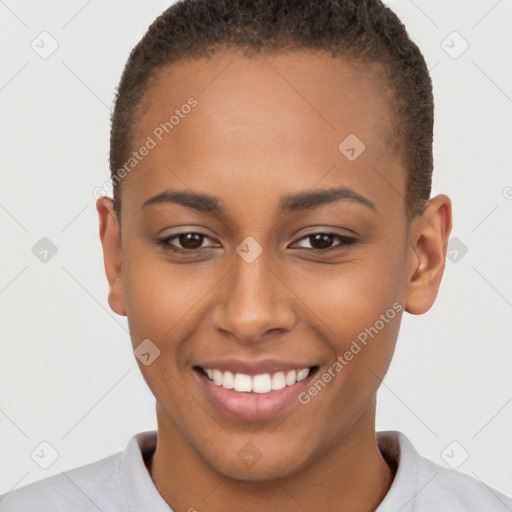 Joyful black young-adult female with short  brown hair and brown eyes