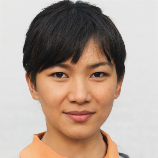 Joyful asian young-adult female with short  black hair and brown eyes