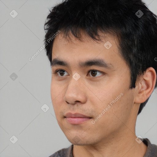 Neutral asian young-adult male with short  black hair and brown eyes