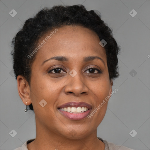 Joyful black adult female with short  brown hair and brown eyes