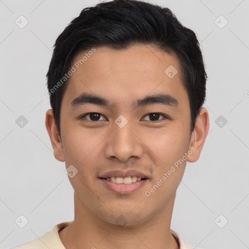 Joyful asian young-adult male with short  black hair and brown eyes