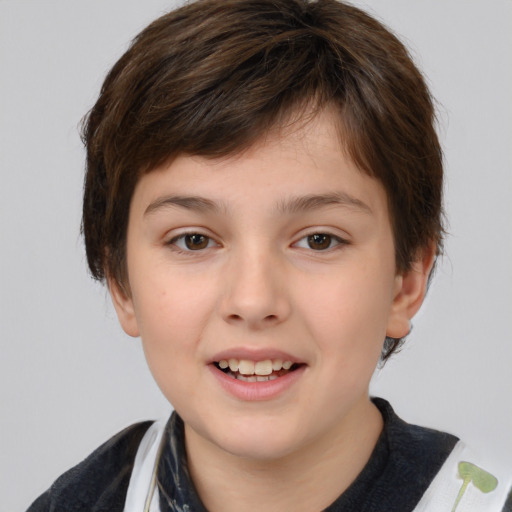 Joyful white child male with short  brown hair and brown eyes