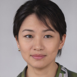 Joyful asian young-adult female with short  brown hair and brown eyes