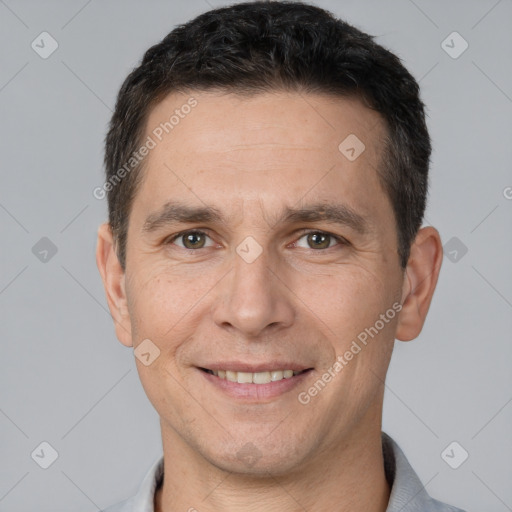 Joyful white adult male with short  brown hair and brown eyes