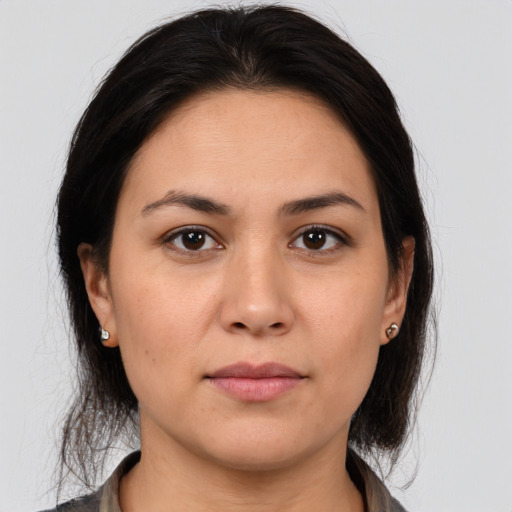 Joyful white young-adult female with medium  brown hair and brown eyes