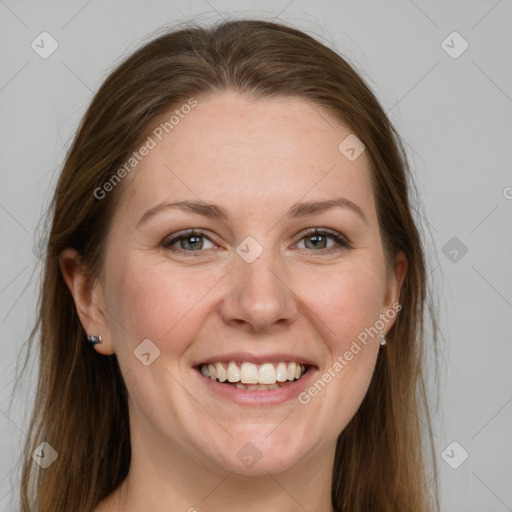 Joyful white adult female with long  brown hair and grey eyes