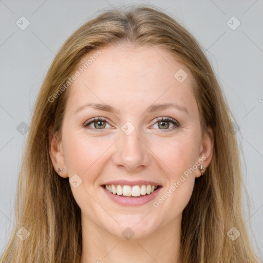 Joyful white young-adult female with long  brown hair and green eyes