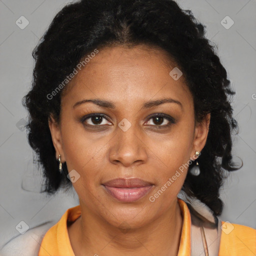 Joyful black adult female with medium  brown hair and brown eyes