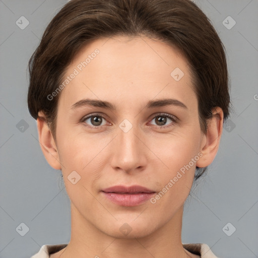 Joyful white young-adult female with short  brown hair and brown eyes