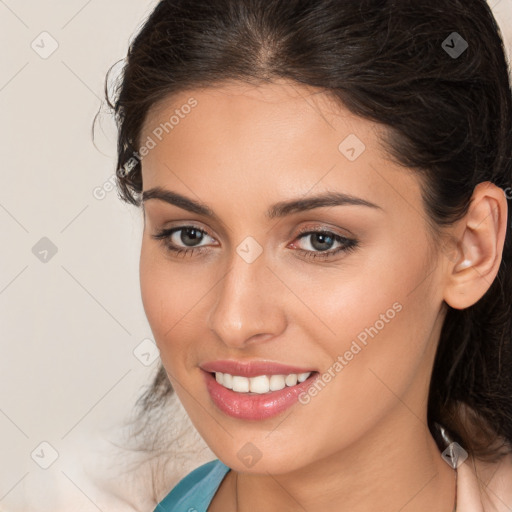 Joyful white young-adult female with long  brown hair and brown eyes