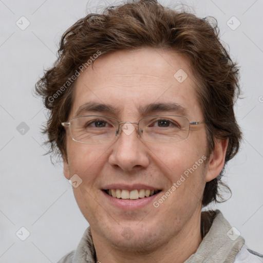 Joyful white adult male with short  brown hair and grey eyes