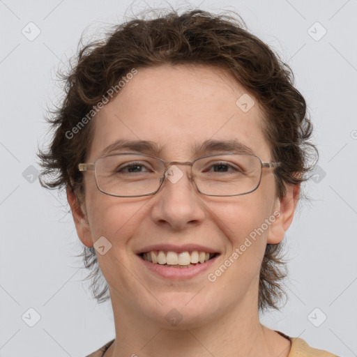 Joyful white adult female with short  brown hair and grey eyes