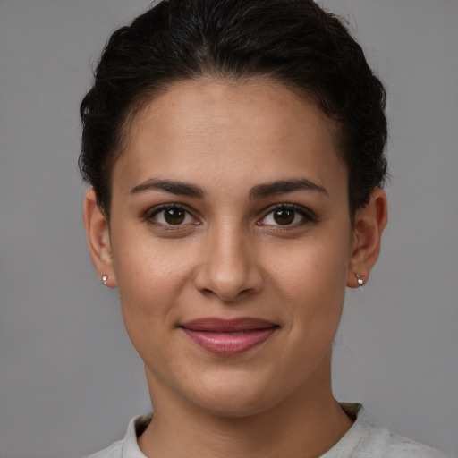 Joyful white young-adult female with short  brown hair and brown eyes