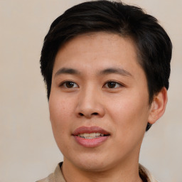 Joyful asian young-adult male with short  brown hair and brown eyes