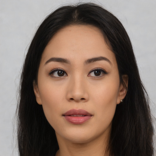 Neutral latino young-adult female with long  brown hair and brown eyes