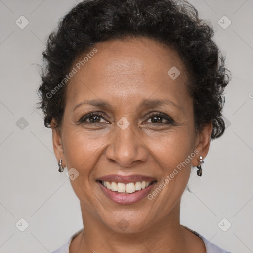 Joyful latino adult female with short  brown hair and brown eyes