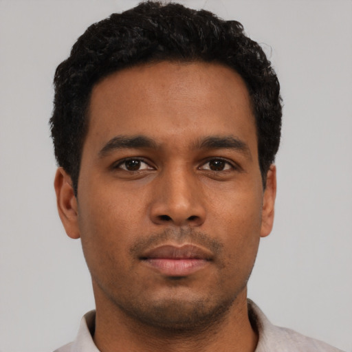 Neutral latino young-adult male with short  brown hair and brown eyes