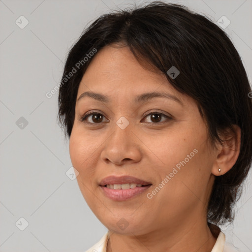 Joyful white adult female with medium  brown hair and brown eyes