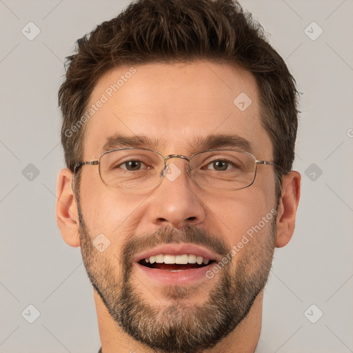 Joyful white adult male with short  brown hair and brown eyes